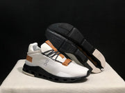 On Cloudnova Sneakers in White, Black and Tan
