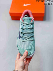 Nike Vapor 12 Low-Top Tennis Sneakers in Mint Green and Coral
