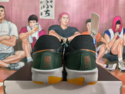 Nike Black and Green Basketball Shoes with Orange Accents