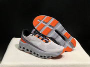 On Cloudmonster Sneakers in Foggy White and Orange