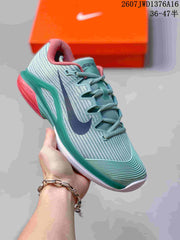 Nike Vapor 12 Low-Top Tennis Sneakers in Mint Green and Coral