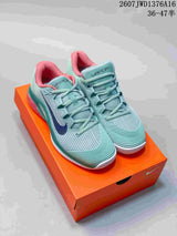Nike Vapor 12 Low-Top Tennis Sneakers in Mint Green and Coral