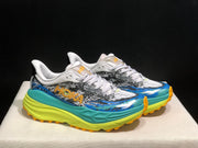 HOKA Stinson 7 Trail Sneakers in Blue and Lime
