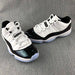 Jordan 11 Low Sneakers in White and Black